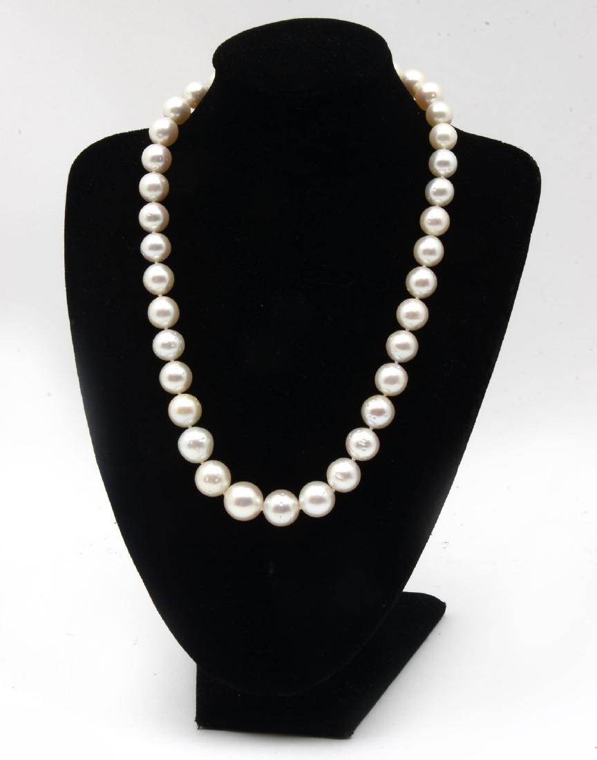 SOUTH SEAS WHITE PEARL NECKLACE WITH 14K CLASP: SOUTH SEAS WHITE PEARL NECKLACE WITH 14K CLASP: 17.75'' single strand of graduated cultured Tahitian pearls with each pearl individually knotted. 37 pearls range in size from 10-14mm with an excellent