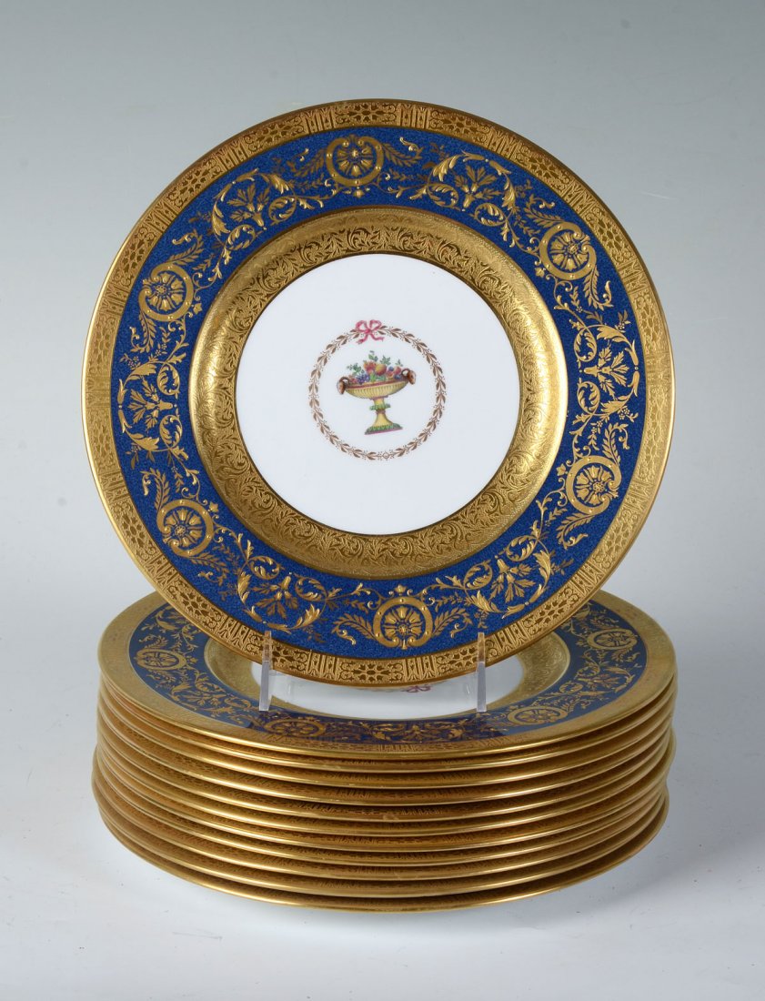 12 COPELAND LUNCHEON PLATES: 12 COPELAND LUNCHEON PLATES: 12 Spode china luncheon plates by Ovington Brothers having a central painted fruit in compote medallion with encompassing Gold borders and a scrolling foliate design on bl