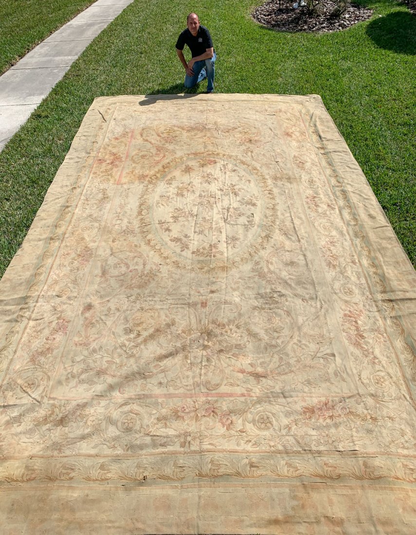 PALATIAL WELL-WORN AUBUSSON CARPET FROM FRENCH CHATEAU: PALATIAL WELL-WORN AUBUSSON CARPET FROM FRENCH CHATEAU: From the Chateau de Fresquiennes, the Peter J. Fischinger home in Pavilly France. 11'3" X 18'8": Provenance: Estate of Dr. Peter J. Fischinger, 