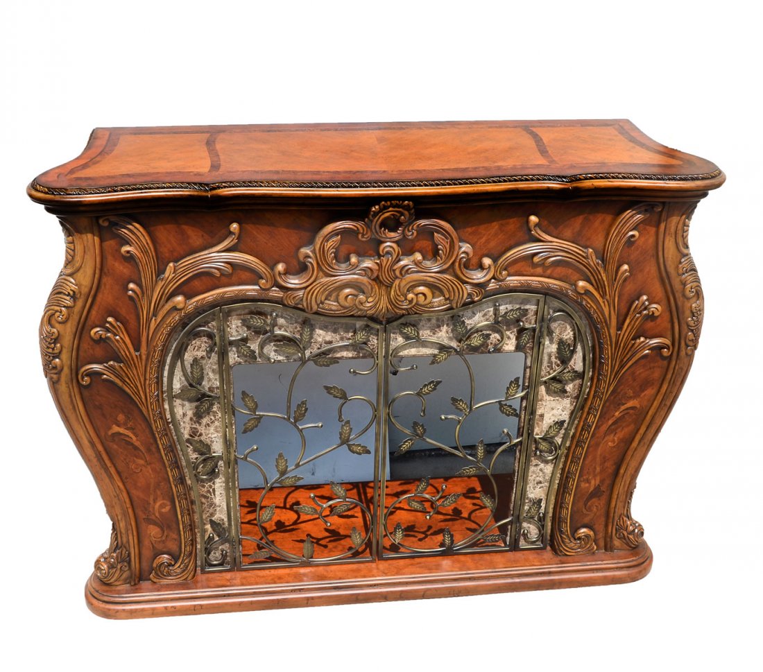 PALAIS ROYALE ROCOCO COGNAC FIREPLACE SURROUND: PALAIS ROYALE ROCOCO COGNAC FIREPLACE SURROUND: Fireplace surround carved by Aico Michael Amini, having an overall scrolling foliate design with an interior marble surround. 2 door metal scrolling gat
