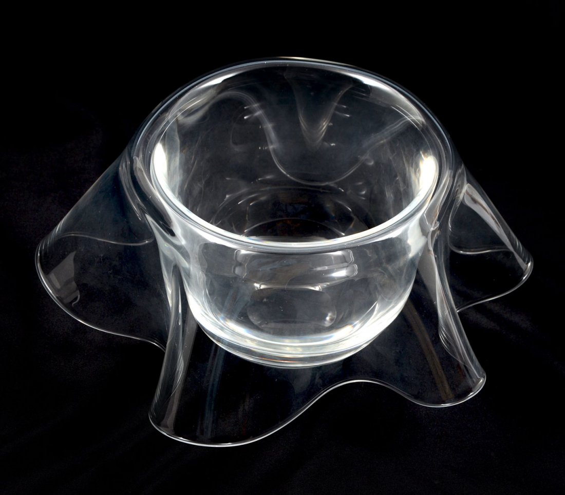PETER HURD STEUBEN BOWL WITH BOX: PETER HURD STEUBEN BOWL WITH BOX: Clear crystal Steuben bowl with curved edges, scalloped rim and etched brand signature at underside. Measures 4" h x 10.75" w. Sold with original presentation box.
