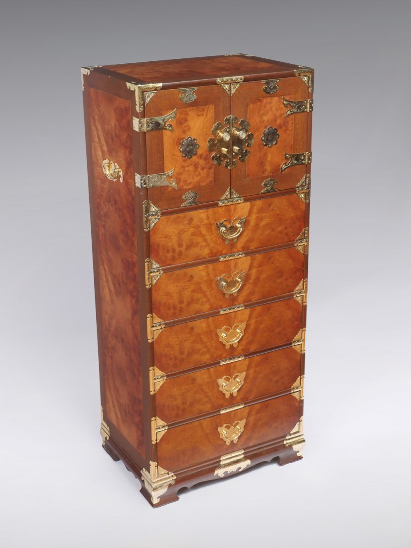 TONSU JEWELRY/LINGERIE CHEST: TONSU JEWELRY/LINGERIE CHEST: Tonsu burlwood jewelry/lingerie chest having 2 door over 5 drawers. Doors open to reveal a compartment & 3 drawer interior. Brass butterfly bail handles and scrolling des