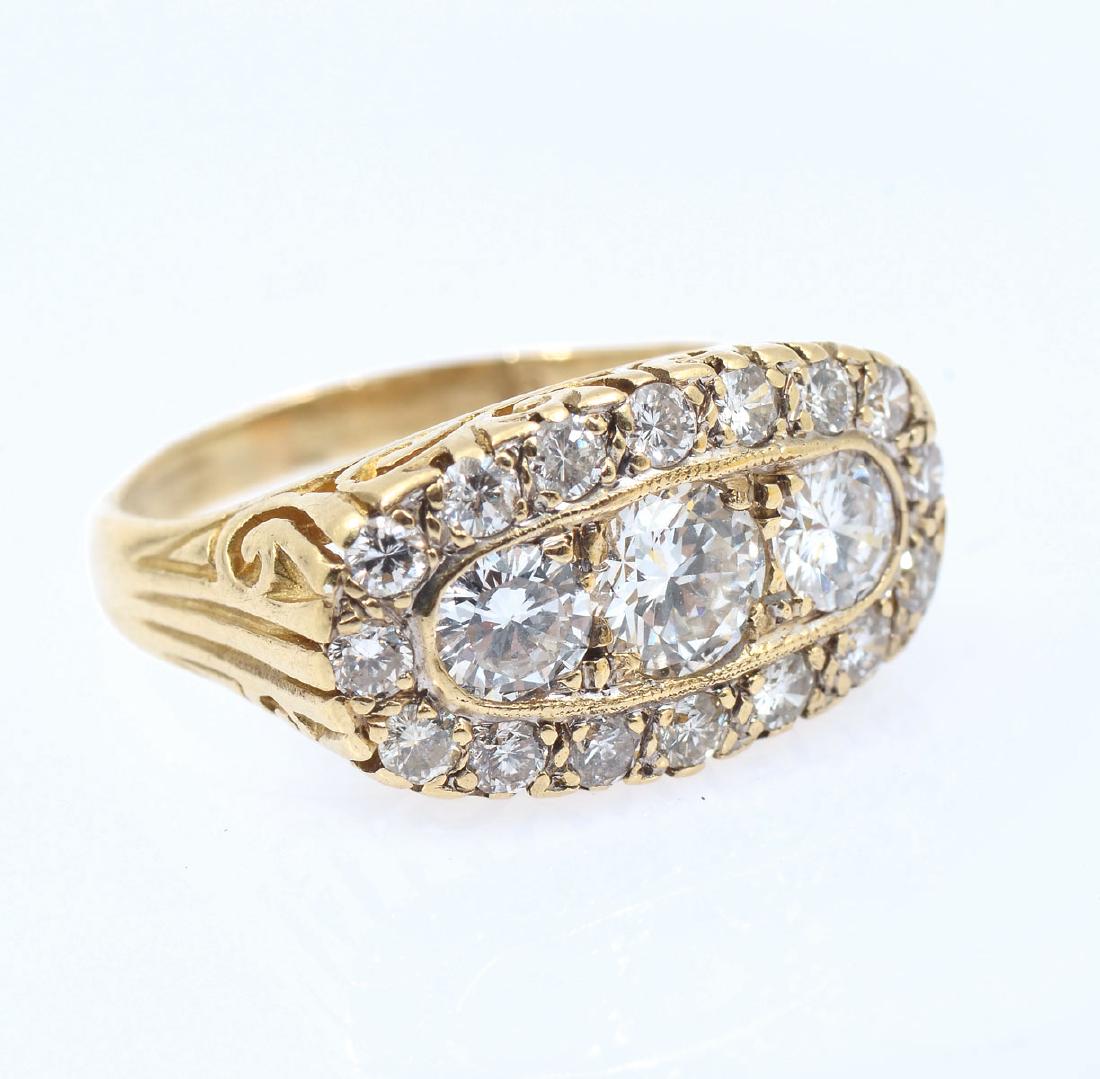 18K & DIAMOND EDWARDIAN REVIVAL RING: 18K & DIAMOND EDWARDIAN REVIVAL RING: 3 round brilliant cut diamonds are encircled by 16 round brilliant cut diamonds for a total carat weight of 2.12 CTW. Diamonds are VS-SI in clarity and H-I-J in c