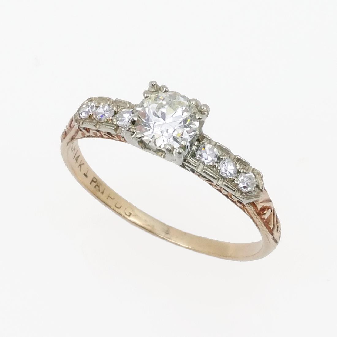 14K ART DECO DIAMOND SOLITAIRE RING: 14K ART DECO DIAMOND SOLITAIRE RING: One old European round cut diamond approx ,48 CT rated VS1 in clarity and G-H in color. 6 round single cut diamonds drape down the shoulders. Total diamond weight 