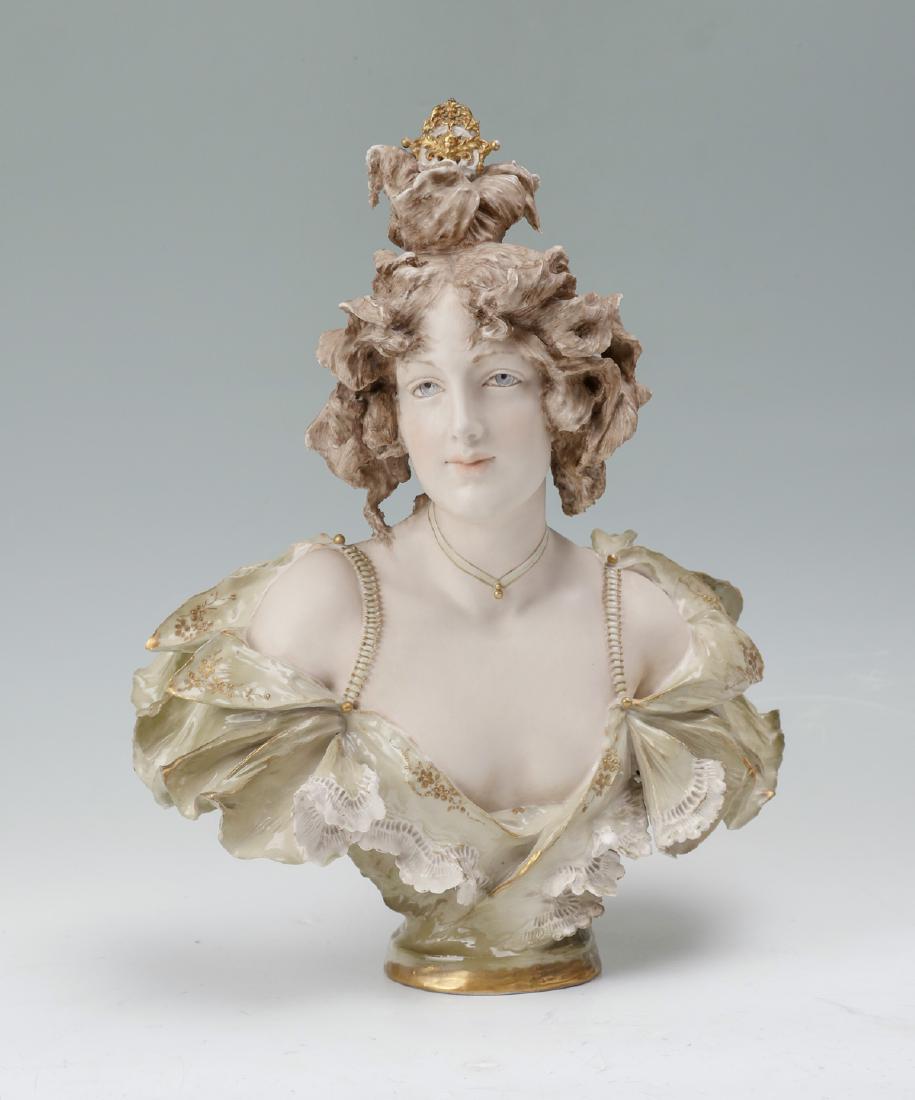 TEPLITZ AMPHORA FEMALE BUST: TEPLITZ AMPHORA FEMALE BUST: Eduard Stellmacher (Reissner, Stellmacher & Kessel) for Turn Teplitz Amphora, Bohemian, 1868-1945, Bust of a Woman, polychrome porcelain, incised signature at lower verso