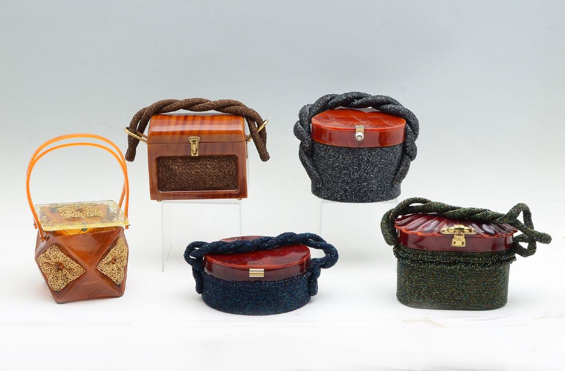 5 VINTAGE BEADED PURSES WITH BAKELITE: 5 VINTAGE BEADED PURSES WITH BAKELITE: 1) Vintage lunch box shaped handbag with gold beaded inserts on the front and back and a beaded braided handle; 2) Vintage charcoal beaded drum purse with Bakeli