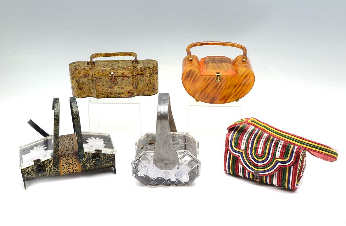 5 ELEGANT VINTAGE PURSES: 5 ELEGANT VINTAGE PURSES: 1) Circa 1930's brown with gold strands Lucite purse. Rare shape; 2) Beautiful tortoise color Bakelite kidney shape purse with handle by Llewellyn Jewel. Some trace of the la