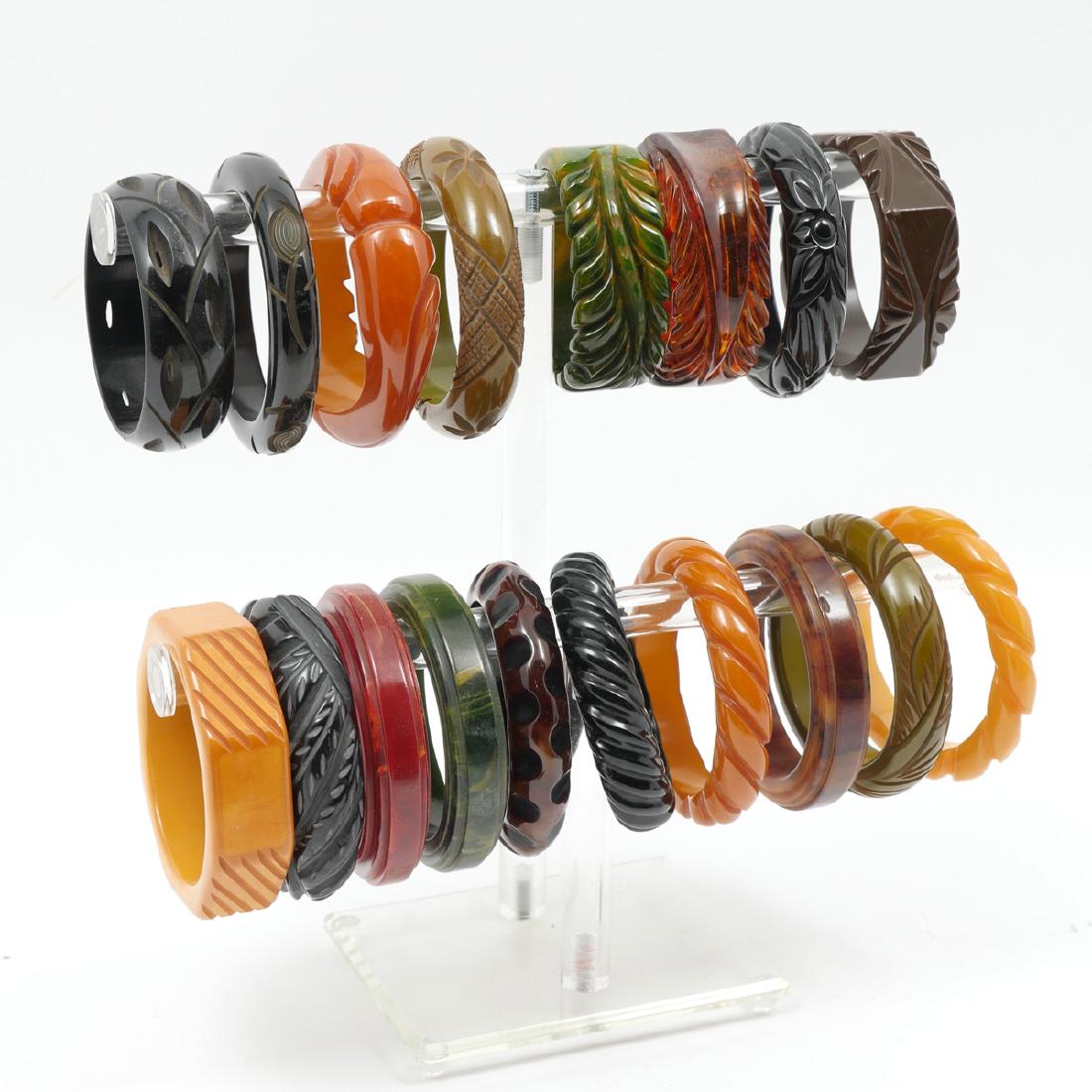 17 BAKELITE BRACELETS: 17 BAKELITE BRACELETS: Wonderful collection of Bakelite bracelets with various carved designs, two with hinge openings. Beautiful colors alone and combined.