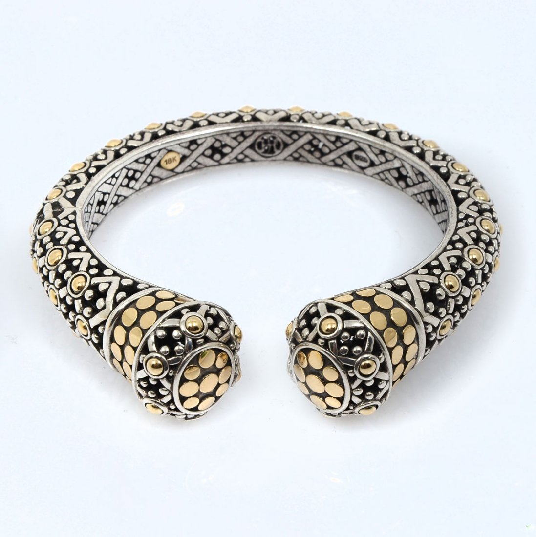 JOHN HARDY 18K & STERLING JAISALMER CUFF BRACELET: JOHN HARDY 18K & STERLING JAISALMER CUFF BRACELET: 18K yellow gold and sterling Jaisalmer Dot Cuff bracelet featuring a high polish and blackened finish and hinged closure, Hallmarks 18K, 925, JH logo