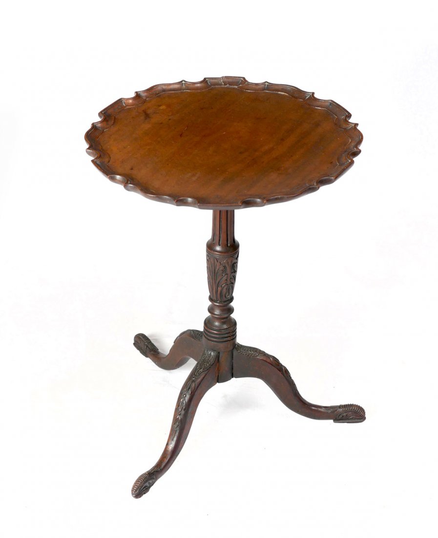 TILT TOP PRE CRUST TABLE: TILT TOP PRE CRUST TABLE: Early pie crust tilt top table on a fluted & carved foliate support. Raised on 3 carved sprawling legs. Approx. 24" h x 18.25" w.
