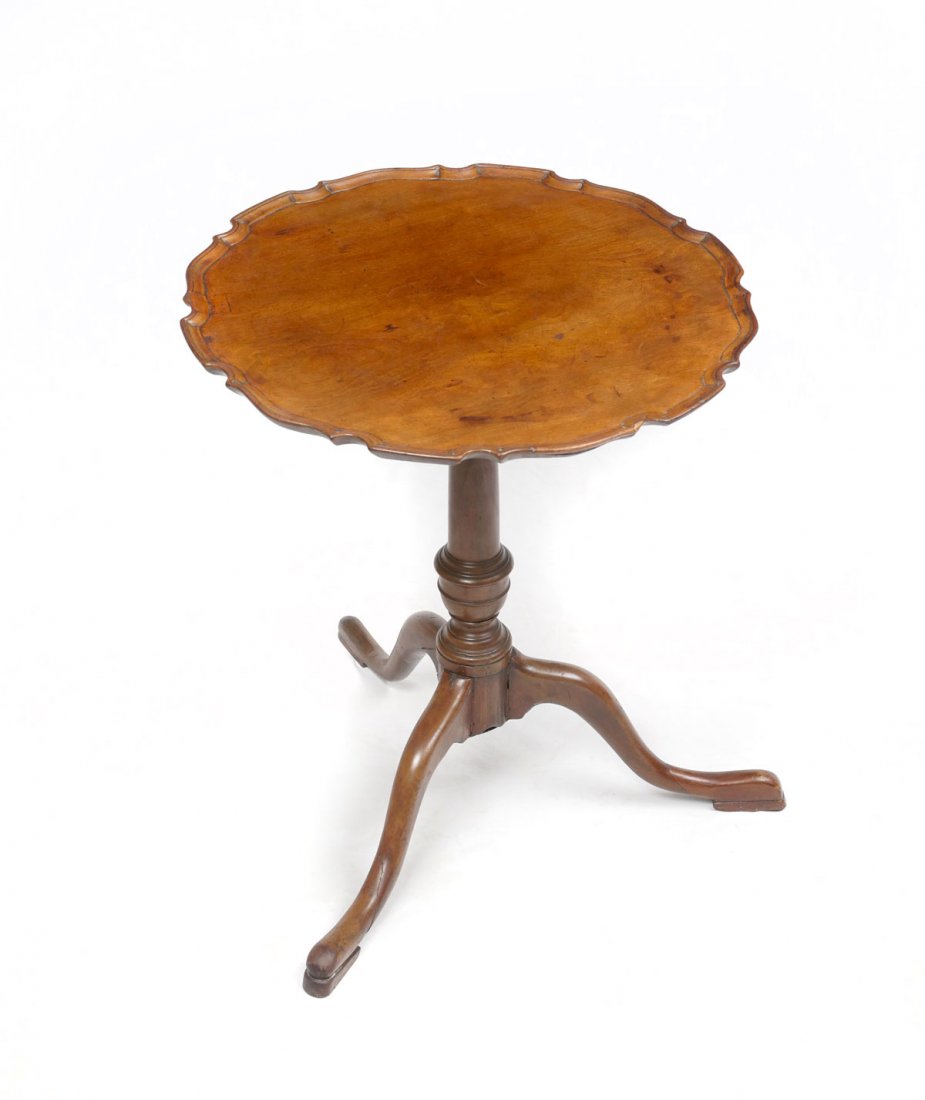 TILT TOP PIE CRUST TABLE: TILT TOP PIE CRUST TABLE: Early pie crust tilt top table on a turned support. Raised on 3 sprawling legs. Approx. 25" h x 22" w.