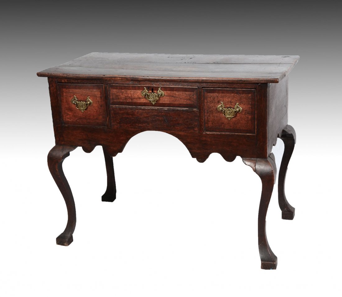 EARLY SCOTTISH OAK LOWBOY: EARLY SCOTTISH OAK LOWBOY: Early Scottish 3 drawer Lowboy raised on cabriole legs. Pierced bail handles. Approx. 30.5" h x 39.25" l x 21.25" w.
