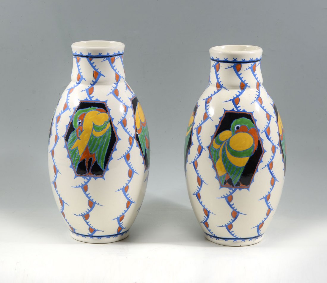 2 PC. BOCH FRERES KERAMIS BIRD VASES: 2 PC. BOCH FRERES KERAMIS BIRD VASES: Pair of Boch Freres Keramis vases having hexagonal windows with birds in center. Blue Mark resides at underside and D 1047 over CT. Approx. 11.5" h x 6" w.