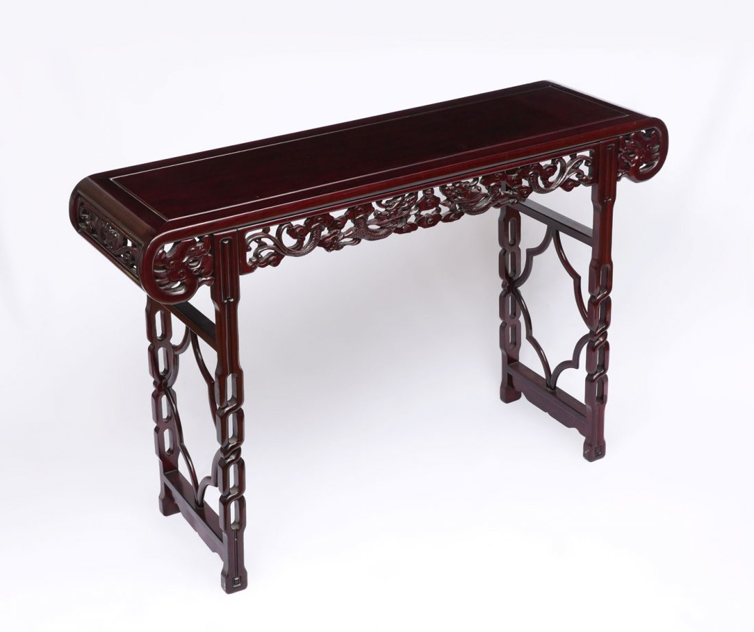CARVED & PIERCED CHINESE ROSEWOOD ALTAR TABLE: CARVED & PIERCED CHINESE ROSEWOOD ALTAR TABLE: Hand-carved Chinese rosewood altar table with carved & pierced dragons amongst the clouds chasing the pearl of wisdom. Top terminates in a scrolling mann