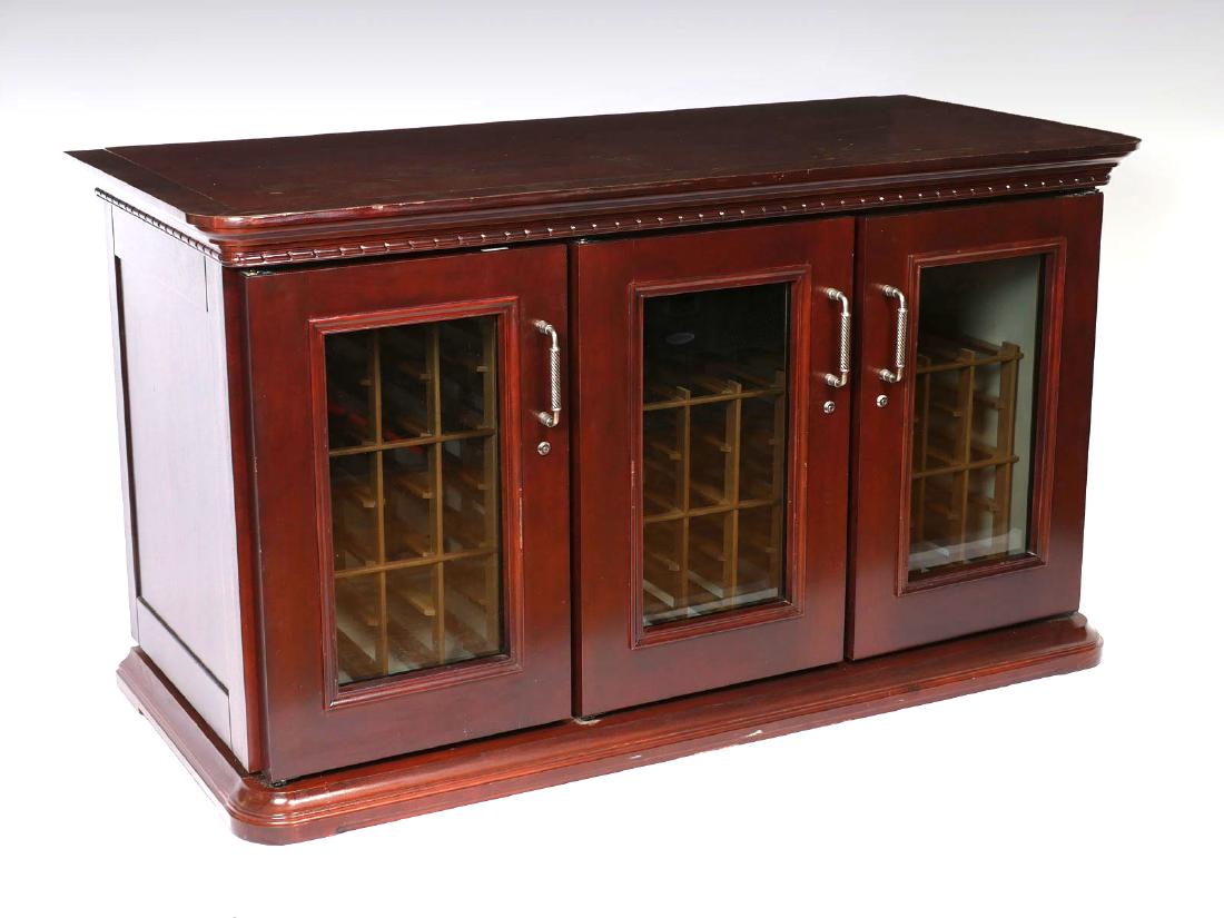 LE CACHE 75 BOTTLE EURO CREDENZA WINE COOLER: LE CACHE 75 BOTTLE EURO CREDENZA WINE COOLER: 75 bottle locking wine cooler in the form of a 3-door credenza by Le Cache, finished in a chocolate cherry veneer and hand-turned pewter pulls. Interior c