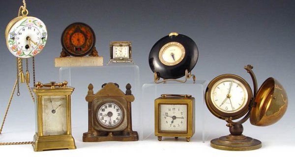 COLLECTION OF 8 SMALL CLOCKS JUNGANS, GLOBE, REMCA: COLLECTION OF 8 SMALL CLOCKS: 1) Jungans carriage clock 3 3/8'' high. 2) German small box carriage 2 1/4'' high. 3) German mini cathedral mantle 3 1/8'' high. 4) Mini porcelain face pendulum 2 3/8'' d