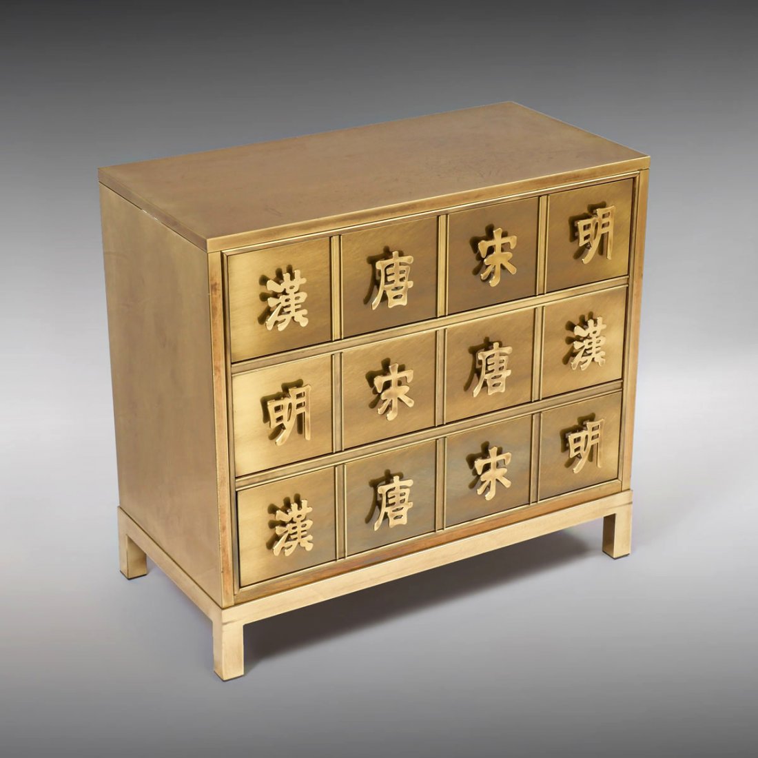 MASTERCRAFT ORIENTAL BRASS CHEST: MASTERCRAFT ORIENTAL BRASS CHEST: Brass 3 drawer chest by Mastercraft having pierced brass symbols as pulls. Raised on square feet. Approx. 29.5" h x 32.25" l x 16.25" w.