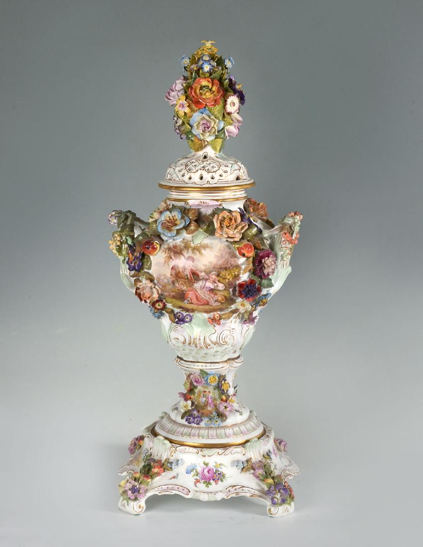 DRESDEN COVERED URN BY CARL THIEME: DRESDEN COVERED URN BY CARL THIEME: Hand-painted Dresden covered urn by Carl Thieme having figural courting scenes & colorful blossoming floral scenes. Elaborately attached delicate floral, fruit, & f