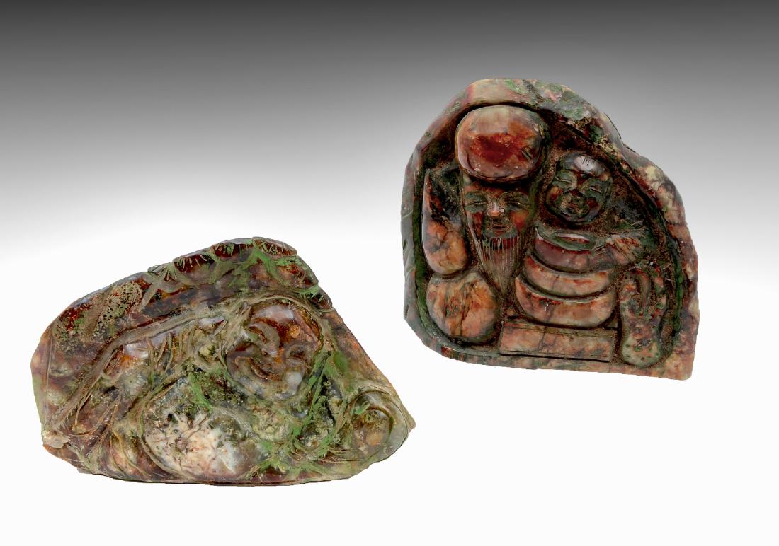 2 CHINESE STONE JADE? CARVINGS: 2 CHINESE HARD STONE CARVINGS: Comprising; 1- carving of the immortal Longevity flanked by a Gourd & a child. Verso depicts a mountainous village scene. 1- carving of a reclining Buddha under foliate.