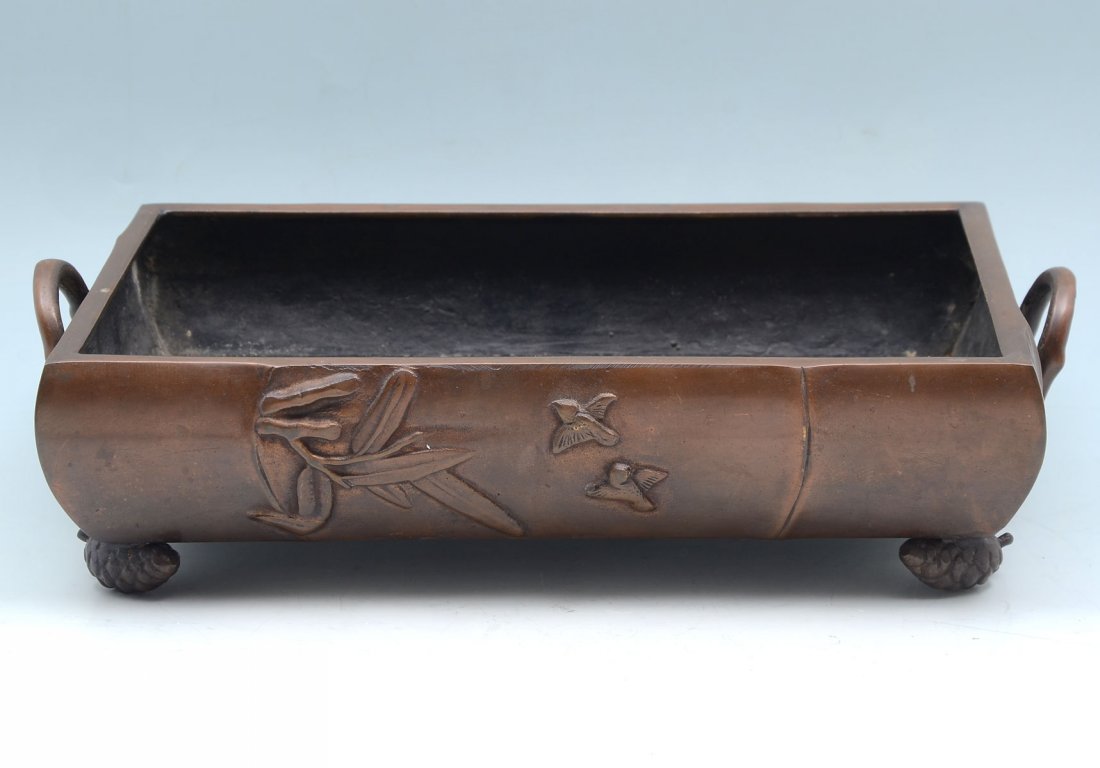 BRONZE JAPANESE MEIJI? SIGNED PLANTER: BRONZE JAPANESE MEIJI? SIGNED PLANTER: Japanese bronze handled planter having a bamboo form with raised birds & bamboo foliate, raised on 4 pinecone feet. Raised signature at underside. Approx. 3.5" h