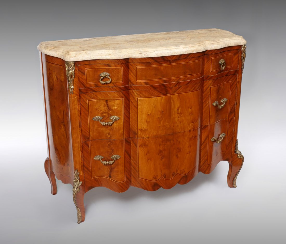 MARBLE TOP 3 DRAWER FRENCH STYLE COMMODE: MARBLE TOP 3 DRAWER FRENCH STYLE COMMODE: 3 drawer banded & book match inlaid burlwood French style commode raised on cabriole legs with metal mounted foliate. Tiered marble top. Approx. 38.5" h x 50"
