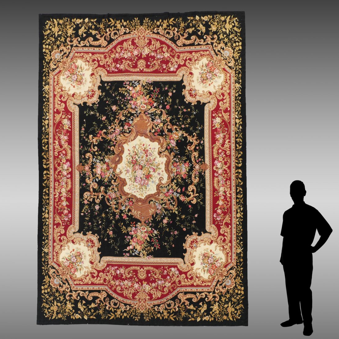 CHINESE FRENCH AUBUSSON DESIGN HAND MADE WOOL RUG: CHINESE FRENCH AUBUSSON DESIGN HAND MADE WOOL RUG, 8'4" X 11'7": This lovely needlepoint rug has a classic Aubusson formal design with a black field outlined by a red main border and a black outer bor