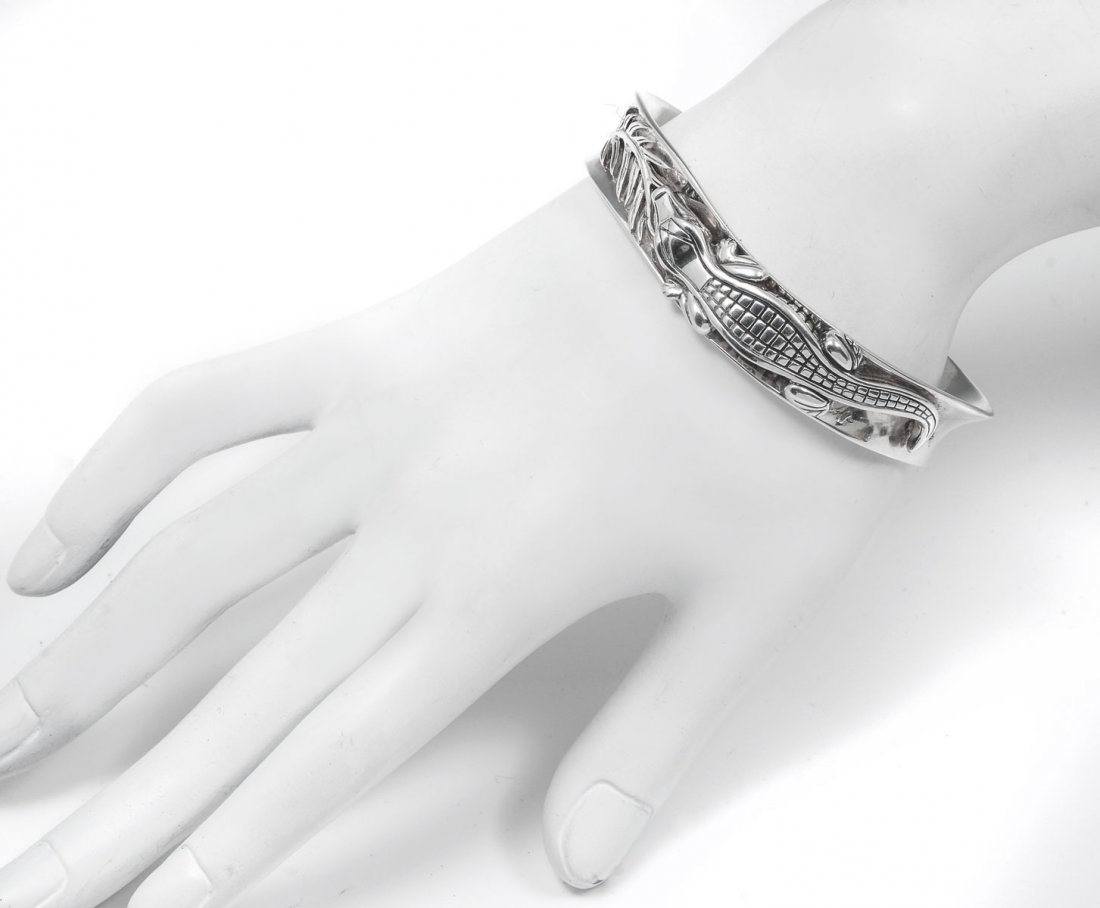 KIESELSTEIN CORD STERLING ALLIGATOR CUFF BRACELET: KIESELSTEIN CORD STERLING ALLIGATOR CUFF BRACELET: Sterling alligator cuff measures 5.75" with 1" opening and .5" wide. Pair of diamonds define the eyes. Marked B KIESELSTEIN CORD 2004 MOON STAR 925. 