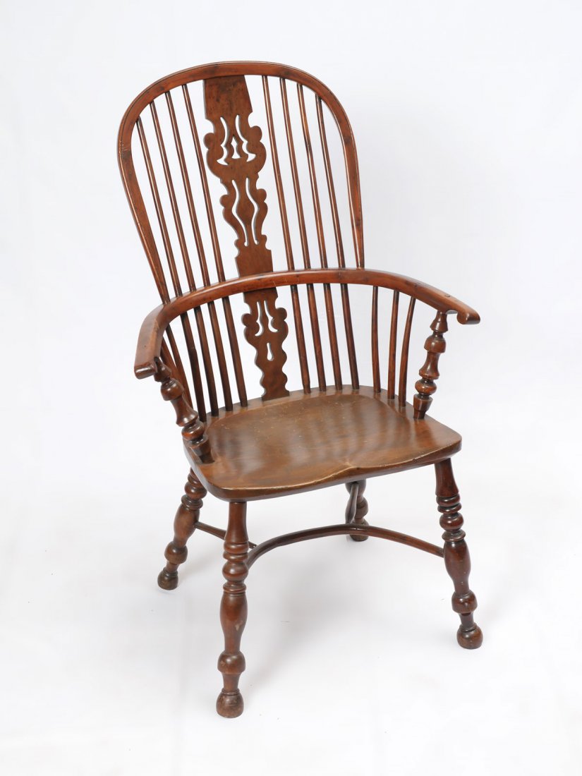 ENGLISH WINDSOR CHAIR: ENGLISH WINDSOR CHAIR: English Windsor chair having a pierced scrolling back splat. Turned spindle supports. Raised on turned legs & feet with a spindle stretcher. Approx. 43.25" h x 27" l x 23.75" w.