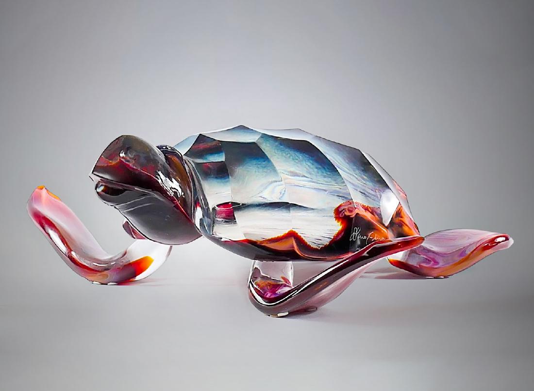 DINO ROSIN GLASS TURTLE SCULPTURE: DINO ROSIN GLASS TURTLE SCULPTURE: Solid art glass sea turtle by Italian artist Dino Rosin, in clear & calcedonia glass, signed at lower left side of shell. Approx. 6'' h x 18.5'' l x 19.75'' w.