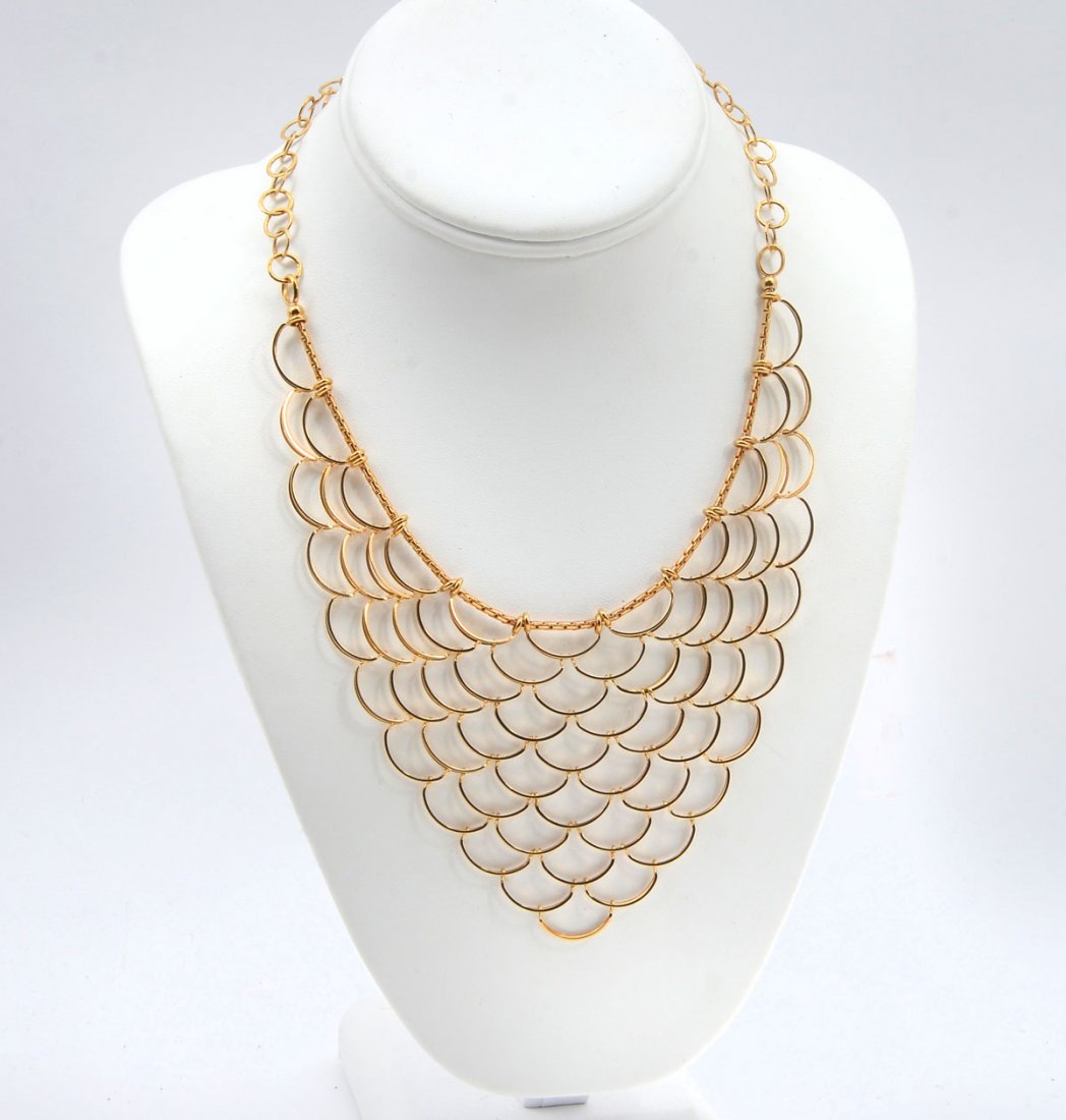 18K MERMAID CASCADING BIB NECKLACE BY ZRW: 18K MERMAID CASCADING BIB NECKLACE BY ZRW: Statement piece of 18K yellow gold jewelry is 36.7 grams. 17.5'' length. ''Bib'' extends 11 tiers or 2.5 at the longest point. Marked 18K Italy ZRW.