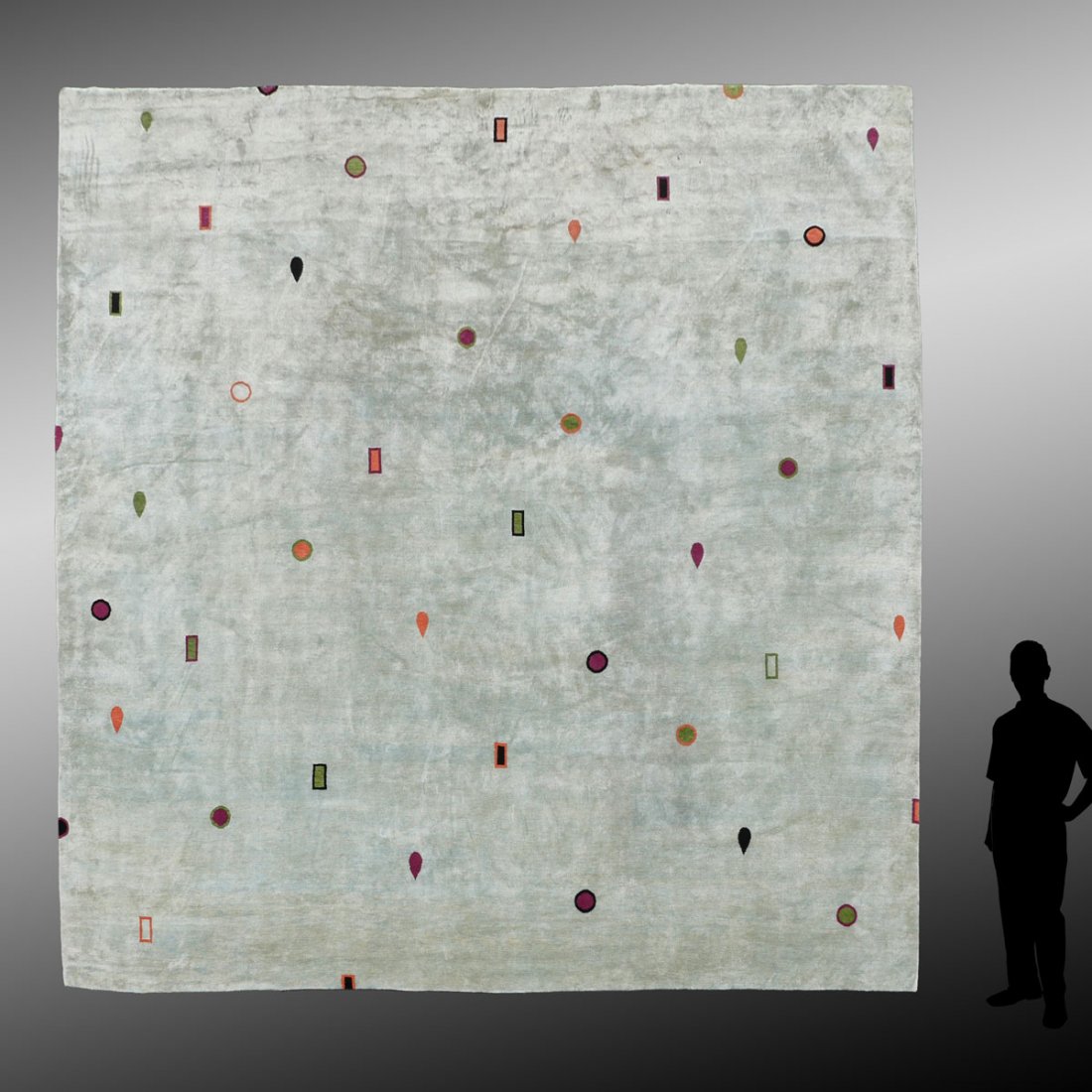 ODEGARD TIBETAN HK WOOL RUG, 13'5'' X 13'10'': ODEGARD TIBETAN HAND KNOTTED WOOL RUG, 13'5" X 13'10": This striking contemporary rug designed by Stephanie Odegard, has an open borderless pale ice blue/green field with a very few scattered small mo