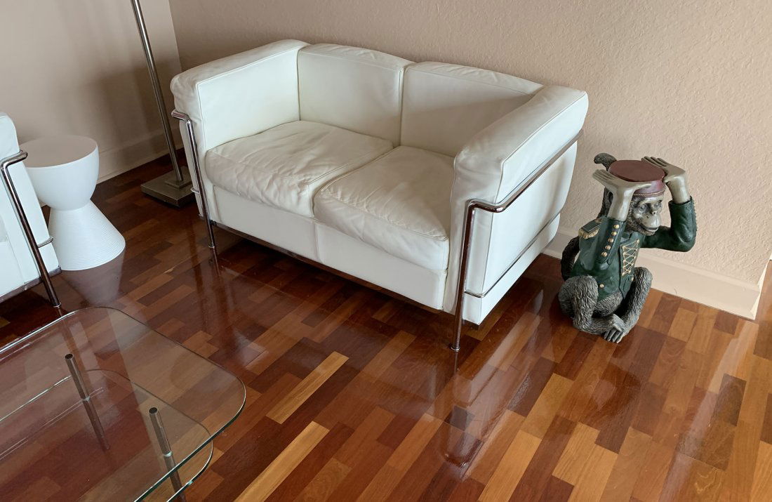 CASSINA LC2 2 SEAT SOFA WHITE LEATHER AND CHROME: CASSINA LC2 2 SEAT SOFA WHITE LEATHER AND CHROME: Approx. 63" h x 65" l x 25.5" w. Consignors bill of sale shows original discounted cost from Cassina at $4486.00.