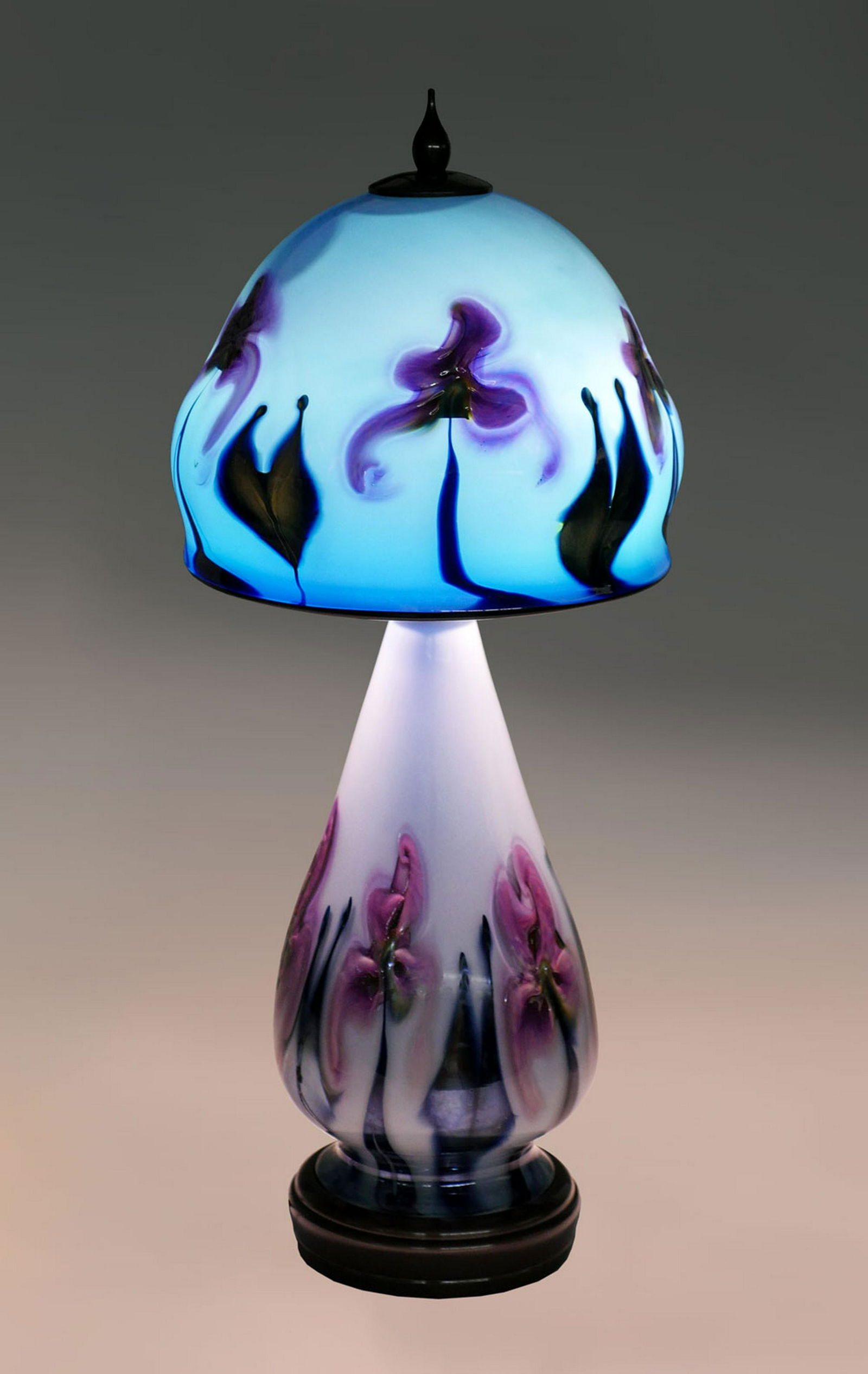 CHARLES LOTTON OPALINE MULTI-FLORA LAMP: CHARLES LOTTON OPALINE MULTI-FLORA LAMP: Art glass 2 light lamp by Charles Lotton, having an opaline ground with Cobalt blue & Pint to Fuchsia flowers. Etched signature at top of shade under patinated