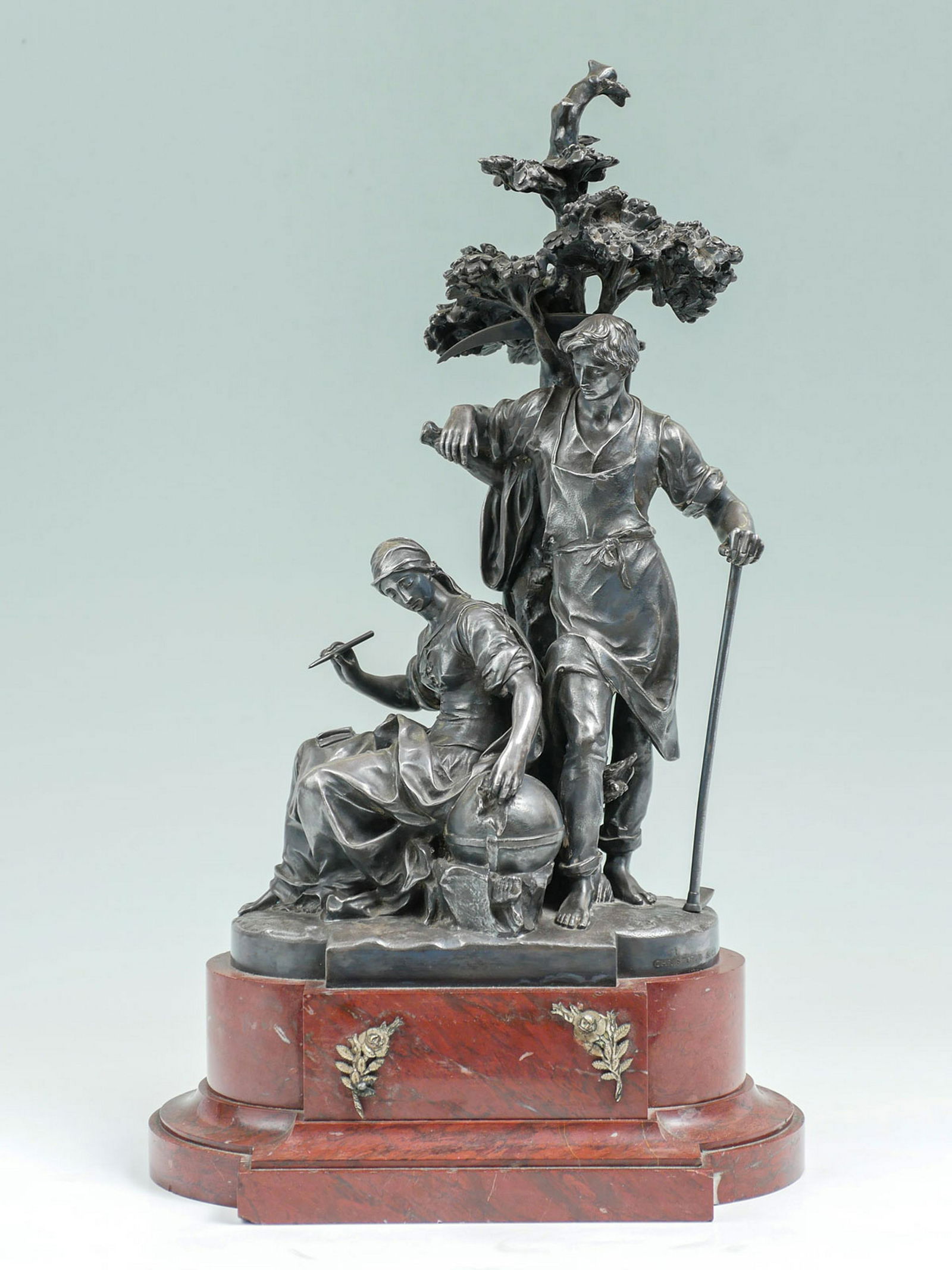 FRENCH FIGURAL SILVERED BRONZE GROUPING BY CHRISTOFLE: FRENCH FIGURAL SILVERED BRONZE GROUPING BY CHRISTOFLE: Depicts Male & Female Figures, approx 15.75" h, rests upon pigeon blood red marble plinth, 19" overall, Marked Christofle and Cie.