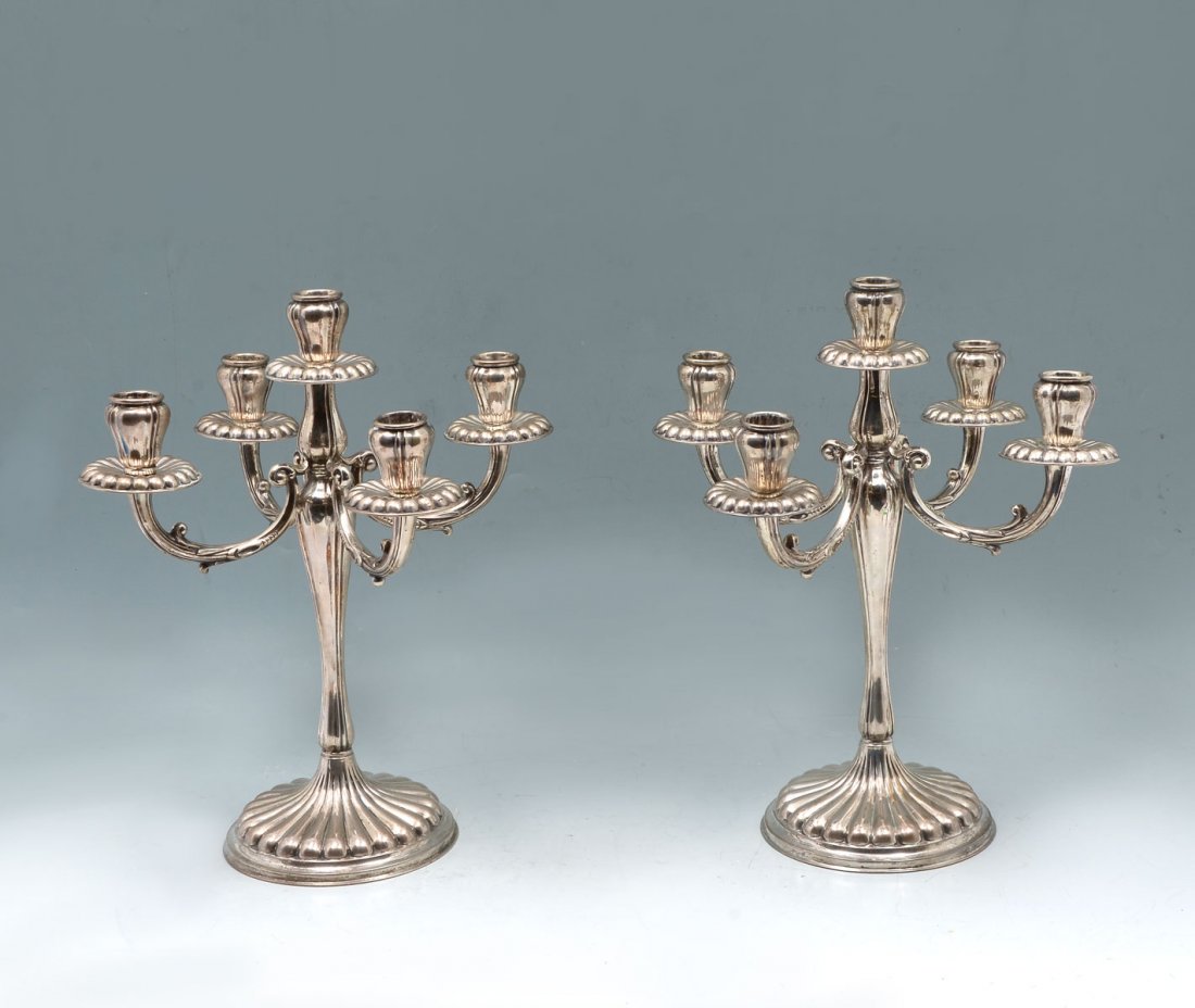 PAIR OF EUROPEAN (.800) SILVER CANDELABRUMS: PAIR OF EUROPEAN (.800) SILVER CANDELABRUMS: Approx. 43.80 ounces. 2 candelabrums having scrolling arms with ribbed base & bobeche. Underside bares an impressed, .800 & an illegible impressed mark. Ap