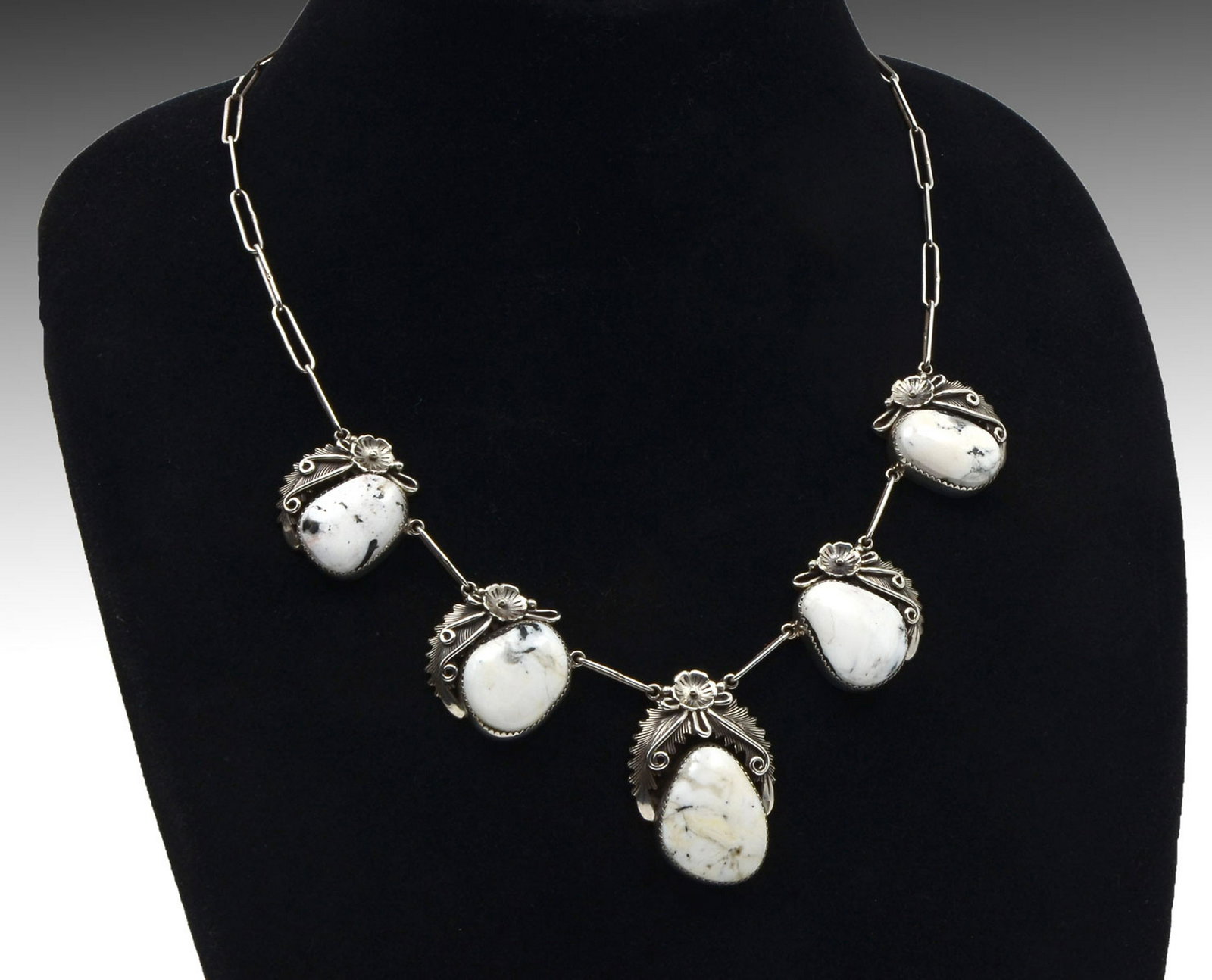 NAVAJO STERLING & WHITE BUFFALO NECKLACE: NAVAJO STERLING & WHITE BUFFALO NECKLACE: Beautiful white buffalo turquoise 5 station necklace in sterling. 19" in length. Signed Peterson Johnson Navajo Sterling, Weight