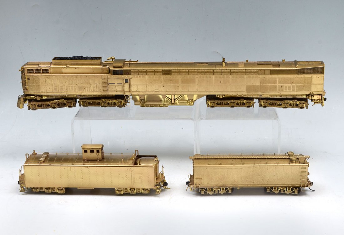 ALCO "JAWN HENRY" BRASS ENGINE & TENDER: ALCO "JAWN HENRY" BRASS ENGINE & TENDER: Norfolk & Western C-C+C-C "Jawn Henry" Steam Turbine model train Engine & Tender by Alco/KMT D 168, 1982. In original box. Approx. 3" h x 19.75" l x 9.5" w.