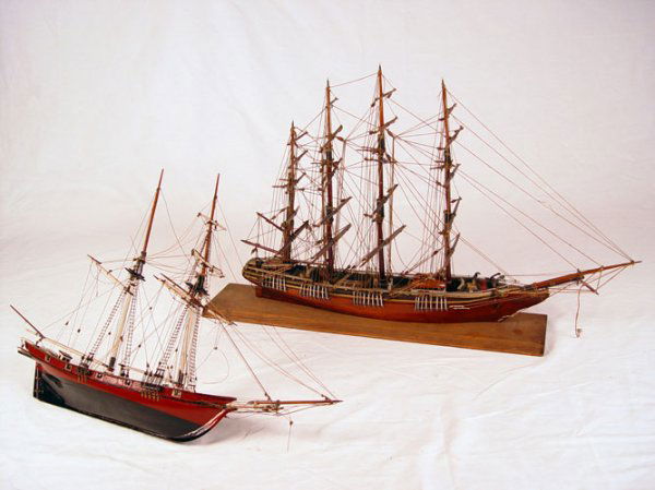 HAND MADE PAIR OF WOODEN CLIPPER SHIP MODELS: HAND MADE PAIR OF WOODEN CLIPPER SHIP MODELS: To include 1) 4 mast clipper, metal accents, movable rudder, lifeboat on side. Mounted on wood stand. Measures 22" high x 37 1/2" long x 7 1/4" wide. Plea