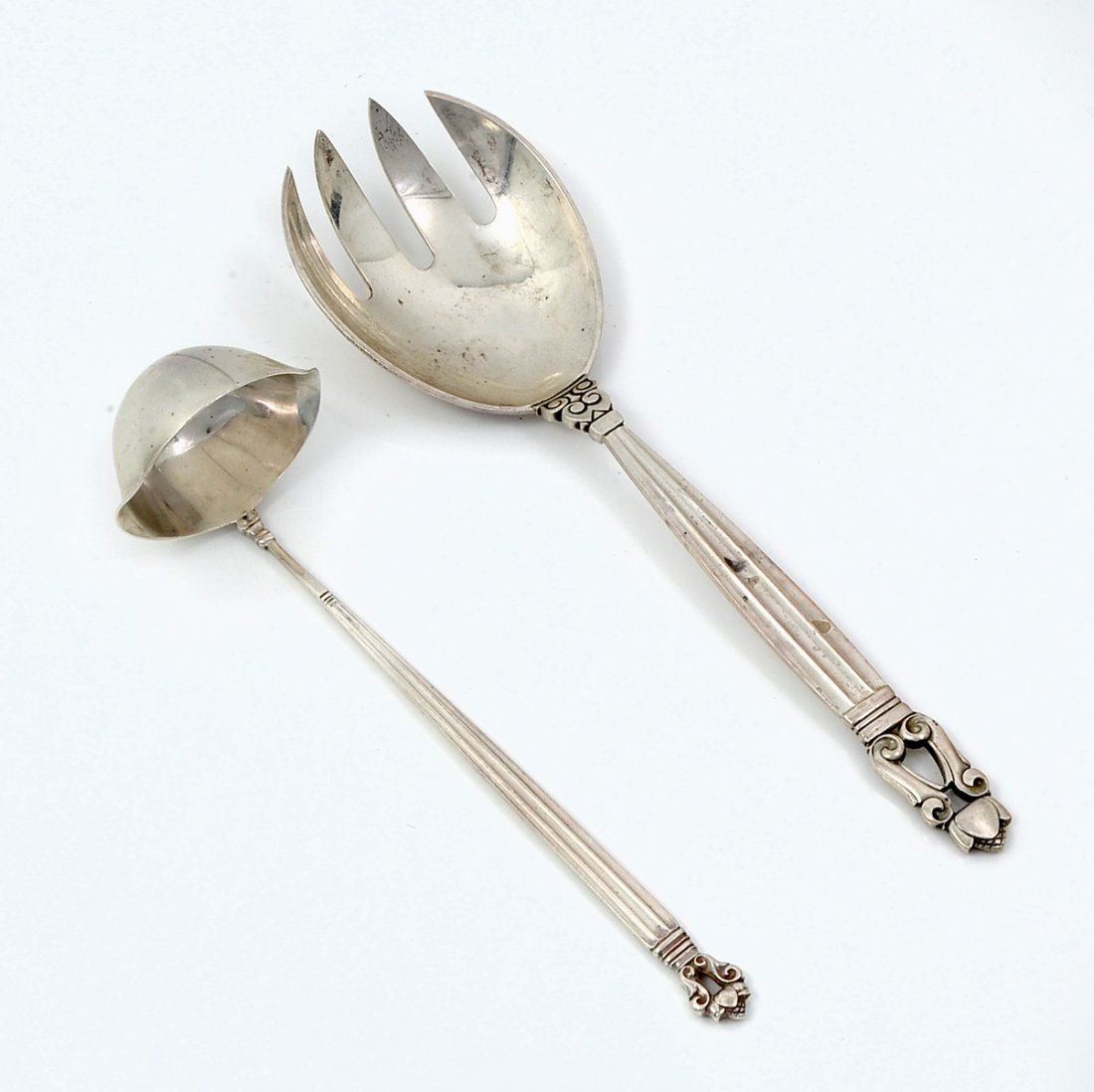 2 PC. GEORG JENSEN DANISH STERLING: 2 PC. GEORG JENSEN DANISH STERLING: Approx. 4.25 Troy ounces Sterling. Comprising; 1- Serving spoon & 1- ladle. Both are of the Acorn pattern by Georg Jensen. Largest Approx. 7.75" l x 2.25" w.