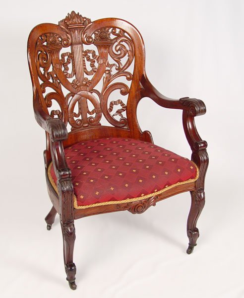 GEORGE HENKELS CARVED & LAMINATED ARM CHAIR