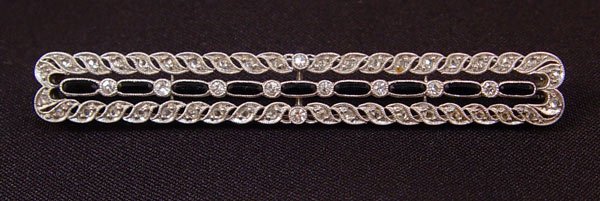 ANTIQUE PLATINUM ONYX & DIAMOND BAR PIN .60 CTW
