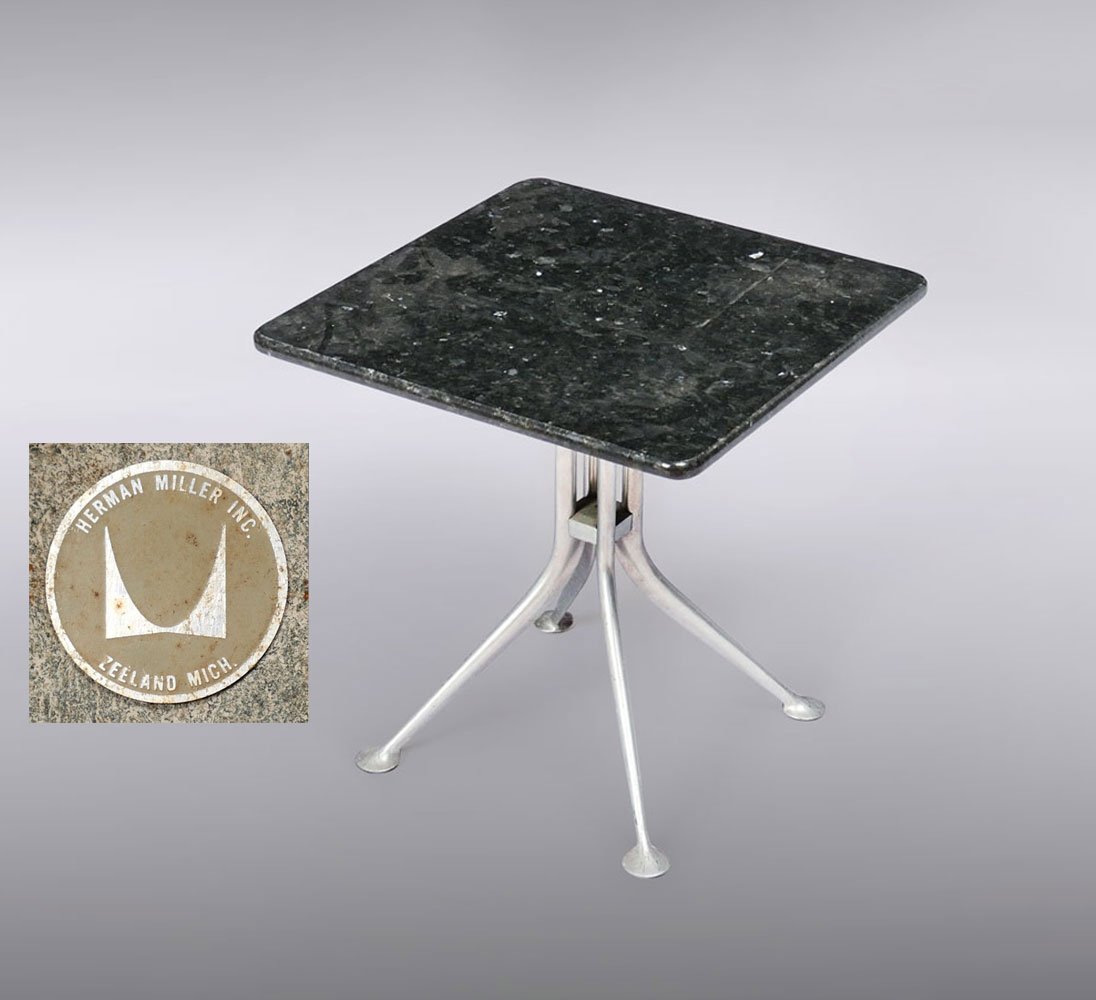 HERMAN MILLER SIDE TABLE: HERMAN MILLER SIDE TABLE: Alexander Girard for Herman Miller. Marble top side table having a cast Aluminum base with sprawling legs. Herman Miller tag resides at the underside. Approx. 20.75" h x 20" 