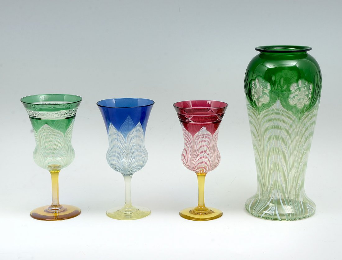 4 PC. DURAND PULLED FEATHER AND WHEEL: 4 PC. DURAND PULLED FEATHER AND WHEEL ENGRAVED VASE & GOBLETS: To include;1- Green Durand vase having Intaglio cut flowers over pulled feather design. As shown in John Schumans American Art Glass page