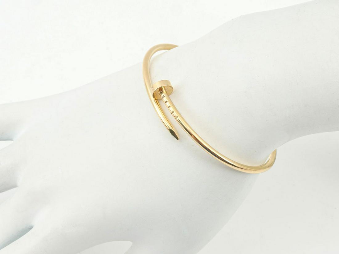 18K CARTIER JUSTE UN CLOU BRACELET SIZE 16: 18K CARTIER JUSTE UN CLOU BRACELET SIZE 16: Juste un Clou is a creative twist on a familiar object. 18K yellow gold, size 16.