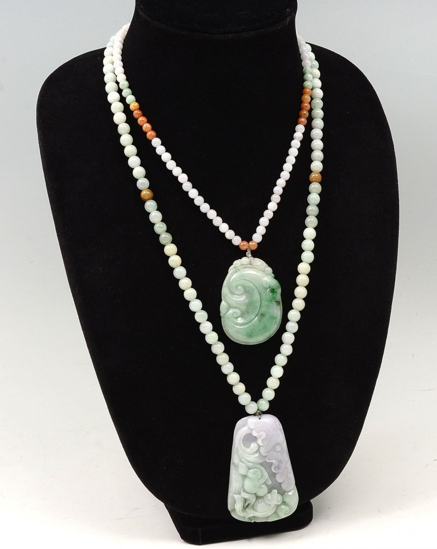 2 CHINESE JADE & JADEITE NECKLACES: 2 CHINESE JADE & JADEITE NECKLACES: 1) Chinese carved Jadeite pendant with goldfish underwater motif measures 2.5'' h x 1.5'' w. Jade bead necklace approx 29''; 2) Chinese Carved Fei Cui jade pendant 