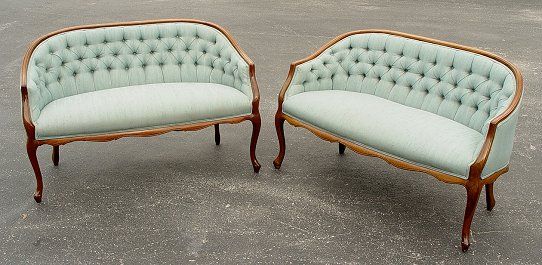 PAIR OF MAHOGANY FRAMED SETTEES: PAIR OF MAHOGANY FRAMED SETTEES: Shaped skirt, cabriole legs. Button and tufted back curves around to form arms. Approx. 48"l. x30"h.