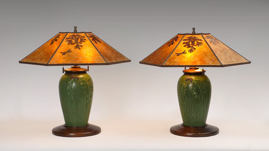 PAIR OF WILLIAM MORRIS STUDIO LAMPS: PAIR OF WILLIAM MORRIS STUDIO LAMPS: Arts & Crafts style pottery lamps by William Morris Studio, having a raised Oak leaf design, mica shades with Oak leaves & Dragonflies. Mahogany bases. Discontinue