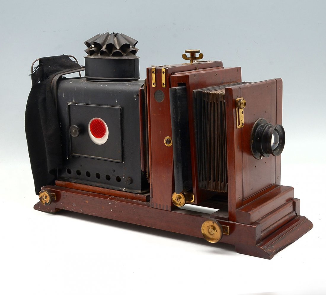 ROSS LONDON XPRESS F4 MAGIC LANTERN: ROSS LONDON XPRESS F4 MAGIC LANTERN: Early 20th century magic lantern with Mahogany framework, central bellow section. Tin light box on adjustable brass track. Ross wide angle xpress F4 lens. #141183.
