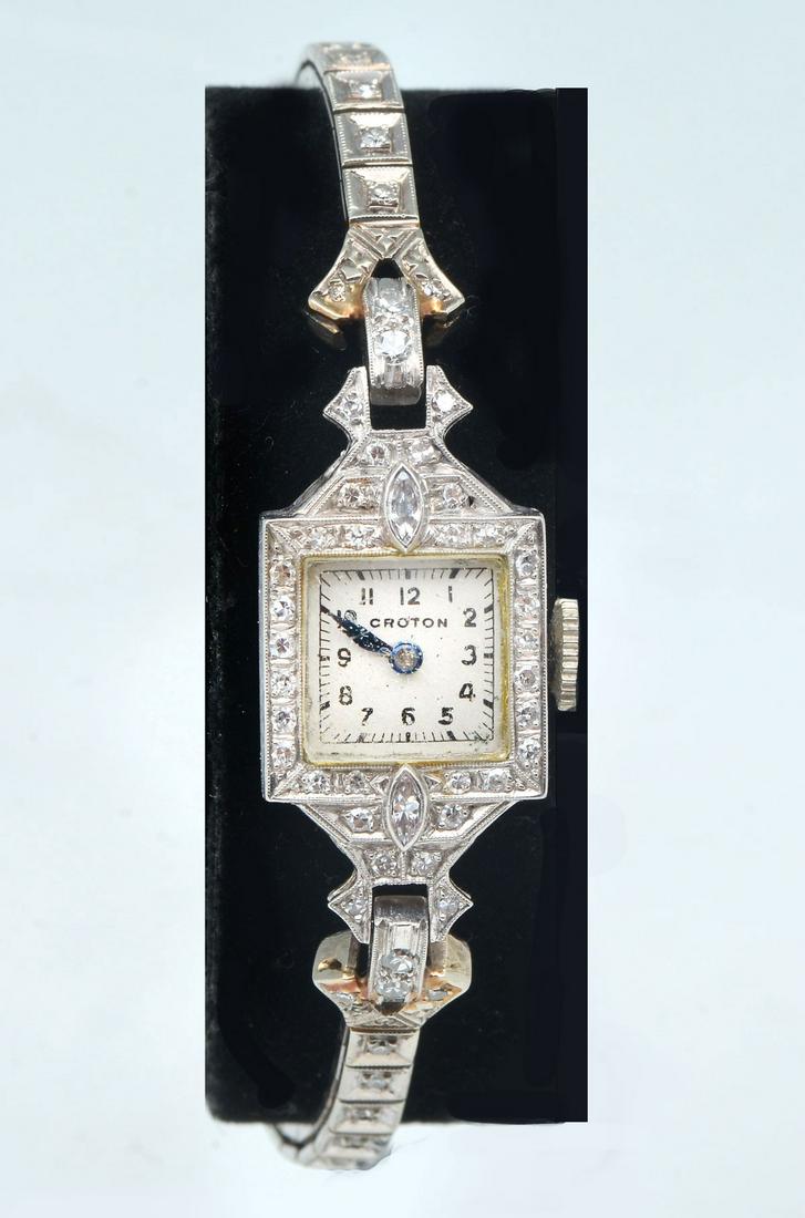 PLATINUM /14K DIAMOND LADIES CROTON WATCH: VINTAGE PLATINUM /14K DIAMOND LADIES CROTON WATCH: Art Deco Croton ladies watch in platinum case with a 6" 14K white gold band set with 68 round single cut diamonds and 2 marquise cut diamonds. Total