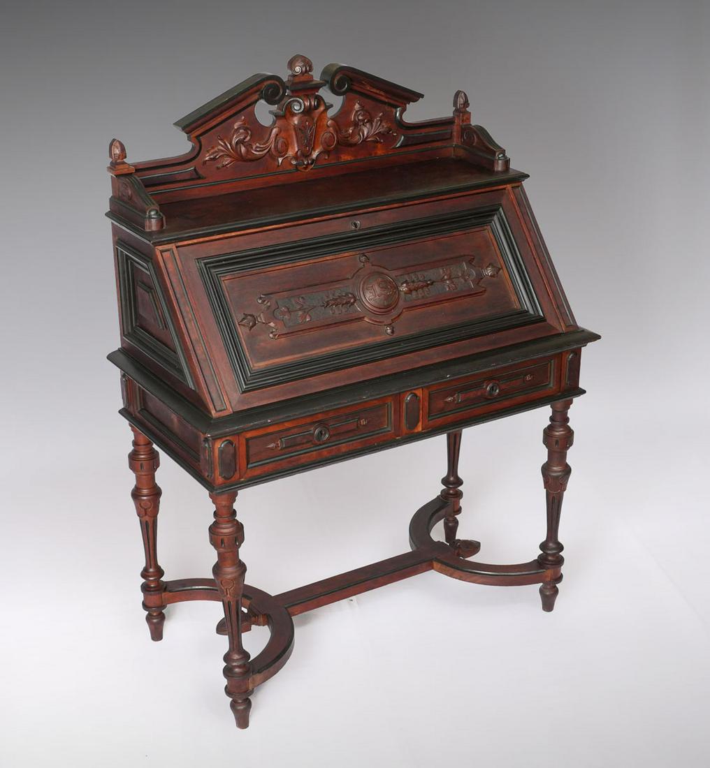 VICTORIAN DROP FRONT DESK: VICTORIAN DROP FRONT DESK: Carved gallery top having a scrolling foliate design, over a medallion & foliate designed lid, monogrammed I.S.S. Lid opens to reveal a compartmented interior. Writing surfa